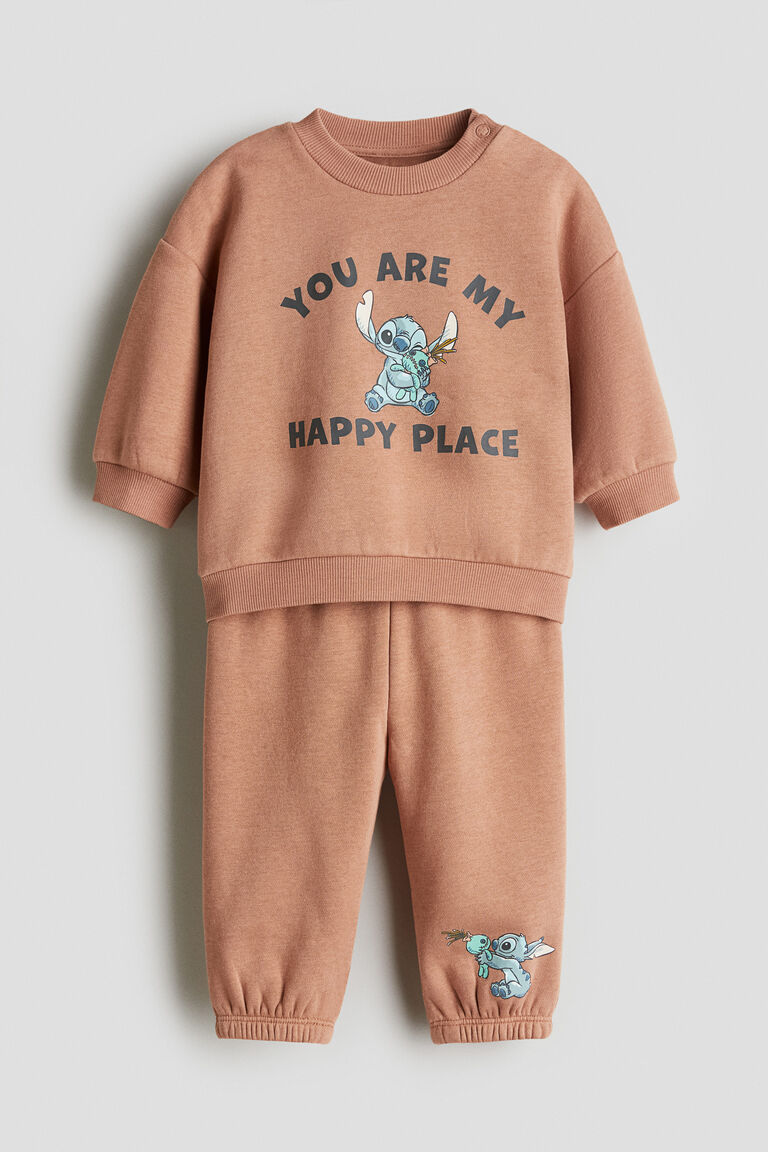 đồ bộ dài tay màu cam nhân vật hoạt hình size 9m - 4y H&M