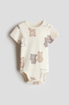 body chip cộc tay màu be con gấu H&M size 4m - 18m